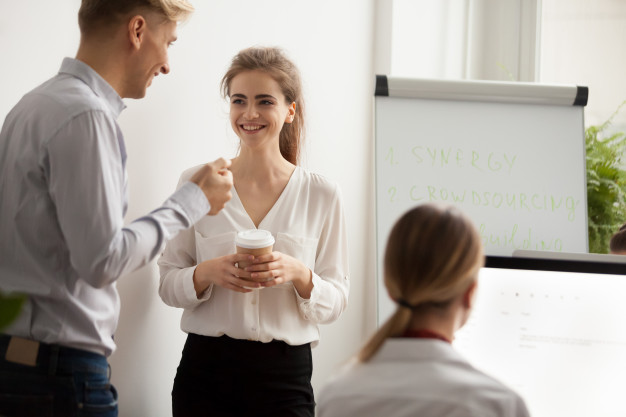 young-colleagues-talking-laughing-coffee-break-coworking-office_1163-4919